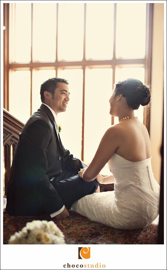 Bride and groom portrait on Kohl Mansion stairway